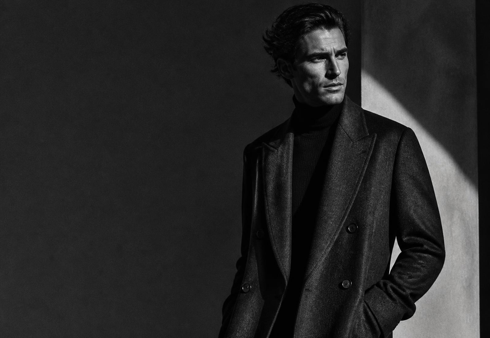 Editorial portrait of a man in a tailored overcoat